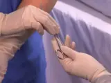 Nurse assisting the doctor during surgery