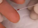 capillary puncture on a person's finger