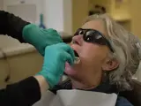 Dentist makes dental impressions